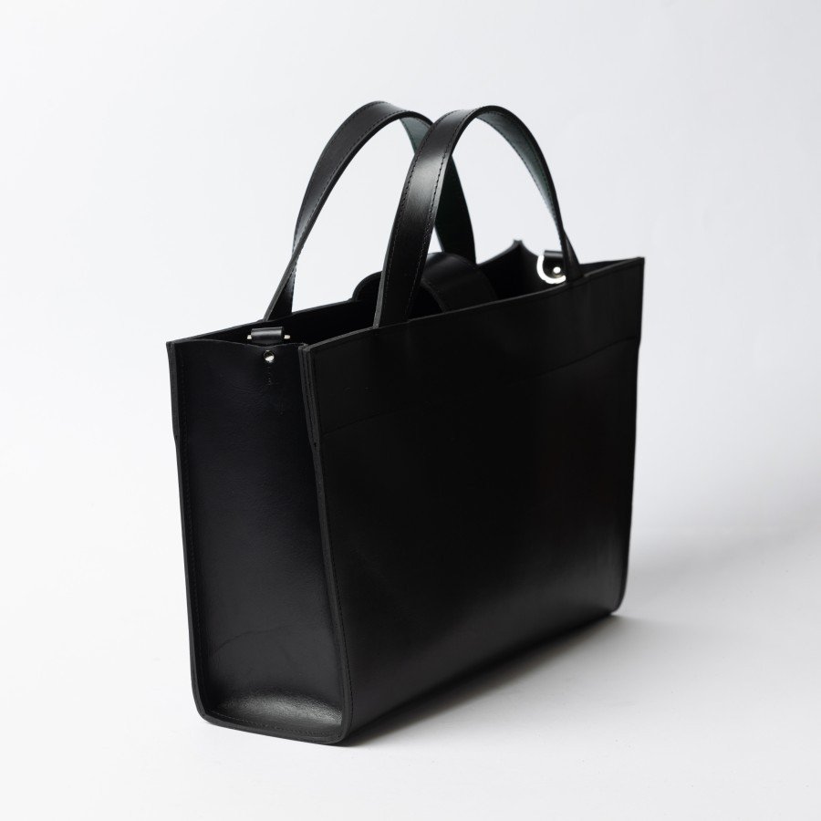 6. Side view of black leather MONIKA tote bag with dual handles