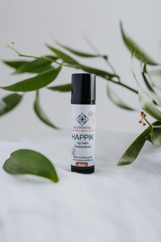 2. MaiWistik Happik Lip Balm in studio setting with herbal ingredients, 5ml tube