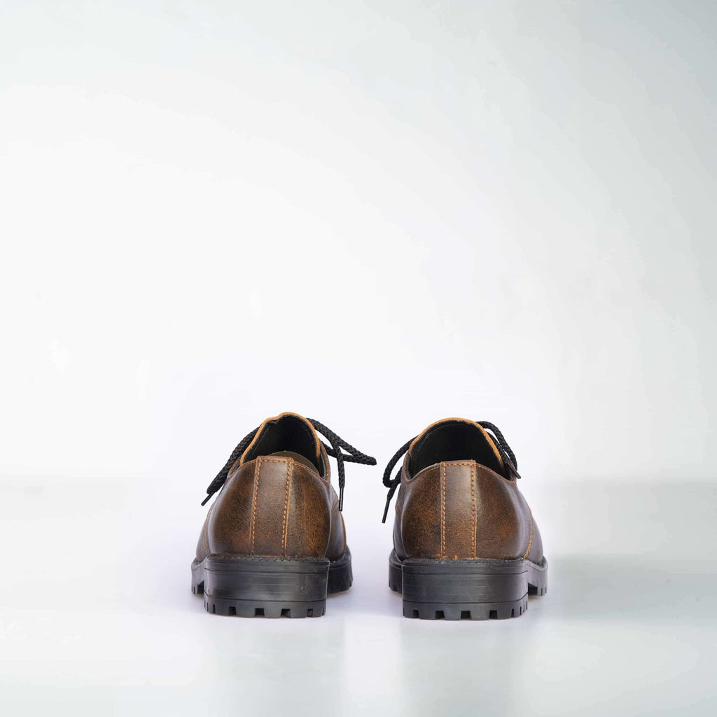 3. Back view of unisex light brown Samelin Widgets, showing leather and textile lining