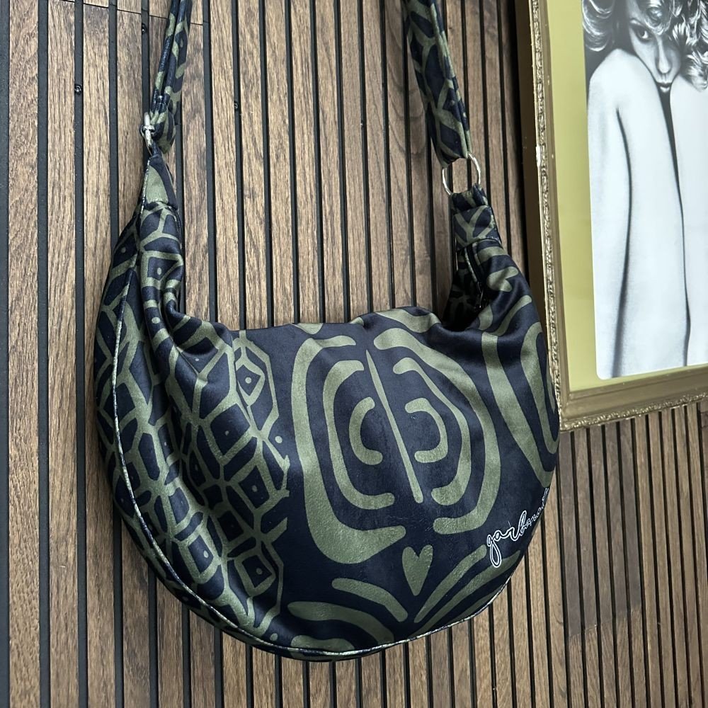 6. Detailed view of Garbanota Hobo Bag in khaki pattern, focusing on the pattern and brand logo