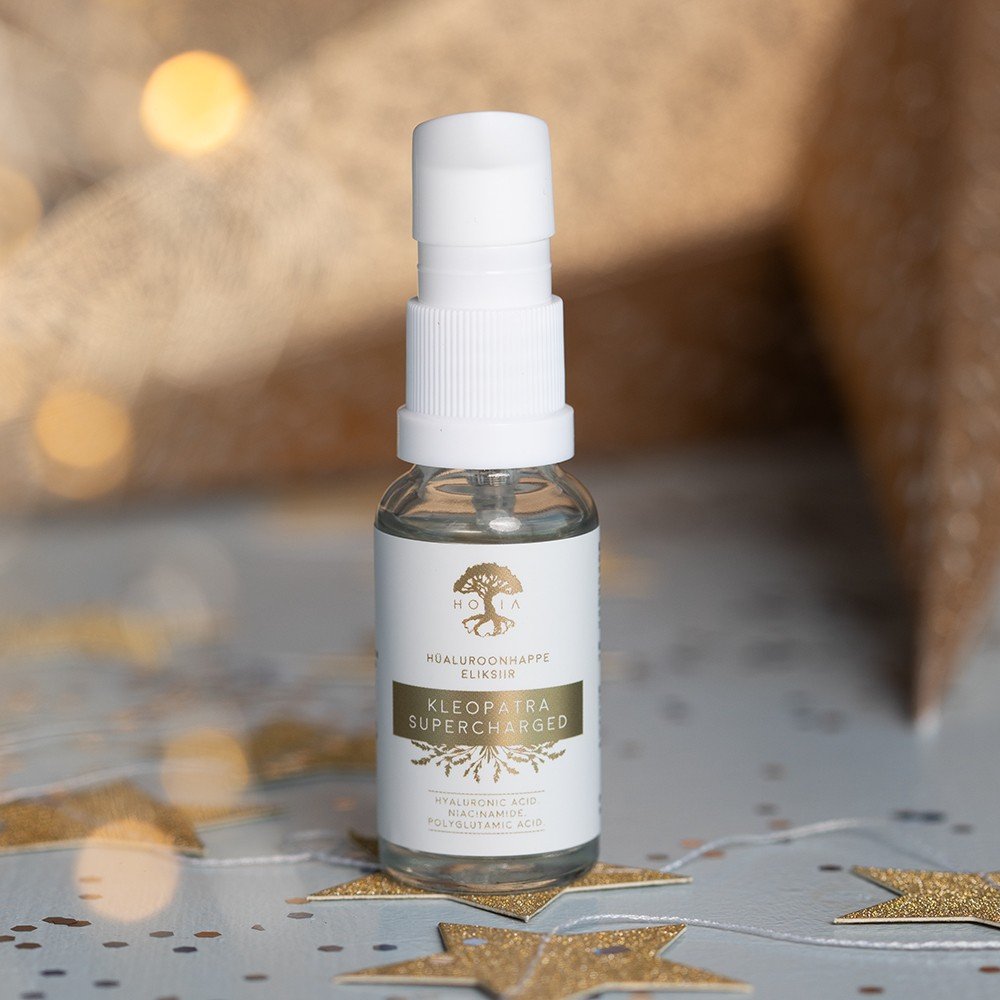 4. HOIA Cleopatra Supercharged Hyaluronic Acid Elixir bottle on star-patterned surface