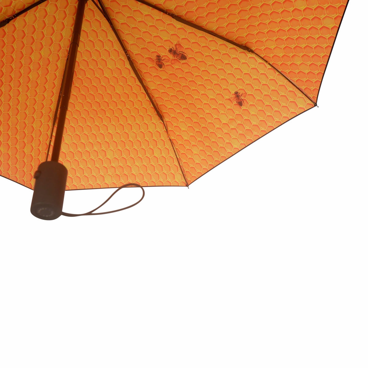 3. Close-up of Honey Umbrella's honeycomb pattern with bee details, highlighting vibrant design