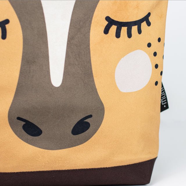 8. Detailed close-up of Muni horse backpack, showing horse face and Muni branding