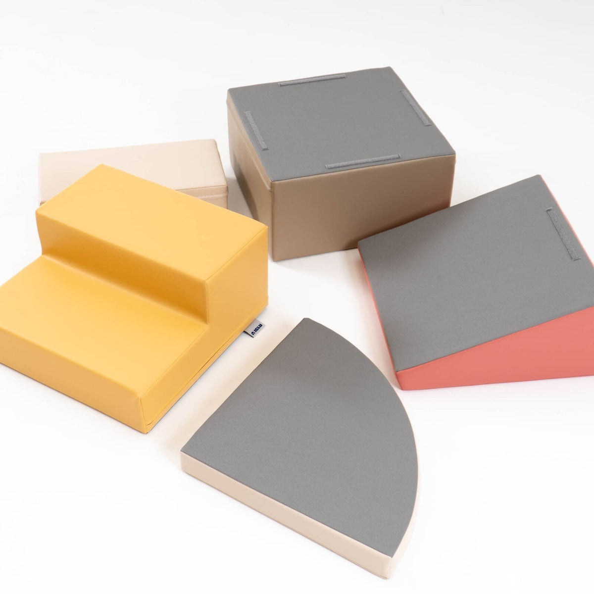 9. Disassembled pastel pink and beige foam blocks showing non-skid bottoms