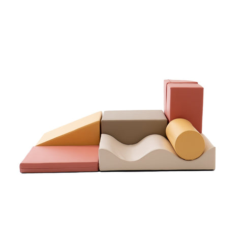 1. IGLU Discoverer 7-piece pastel pink foam block set arranged in a creative layout on a white background