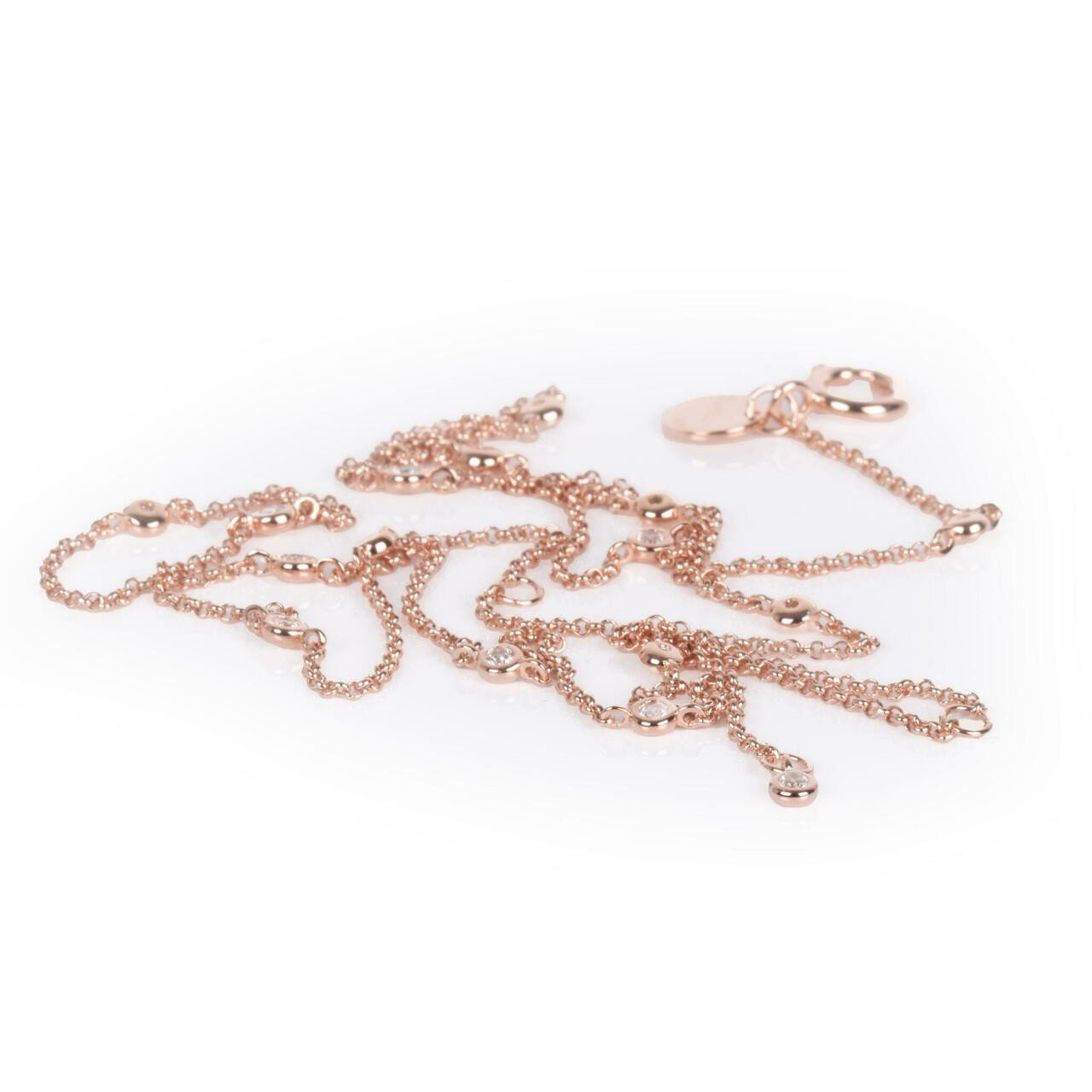 5. Flat lay of Illumi Doubled S Necklace in rose gold, showing chain details and MyaMoon logo tag