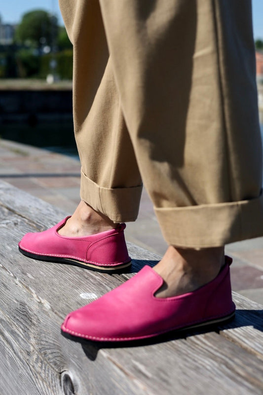 1. Women's pink TOKU London shoes by Omaking worn with beige pants, outdoor setting