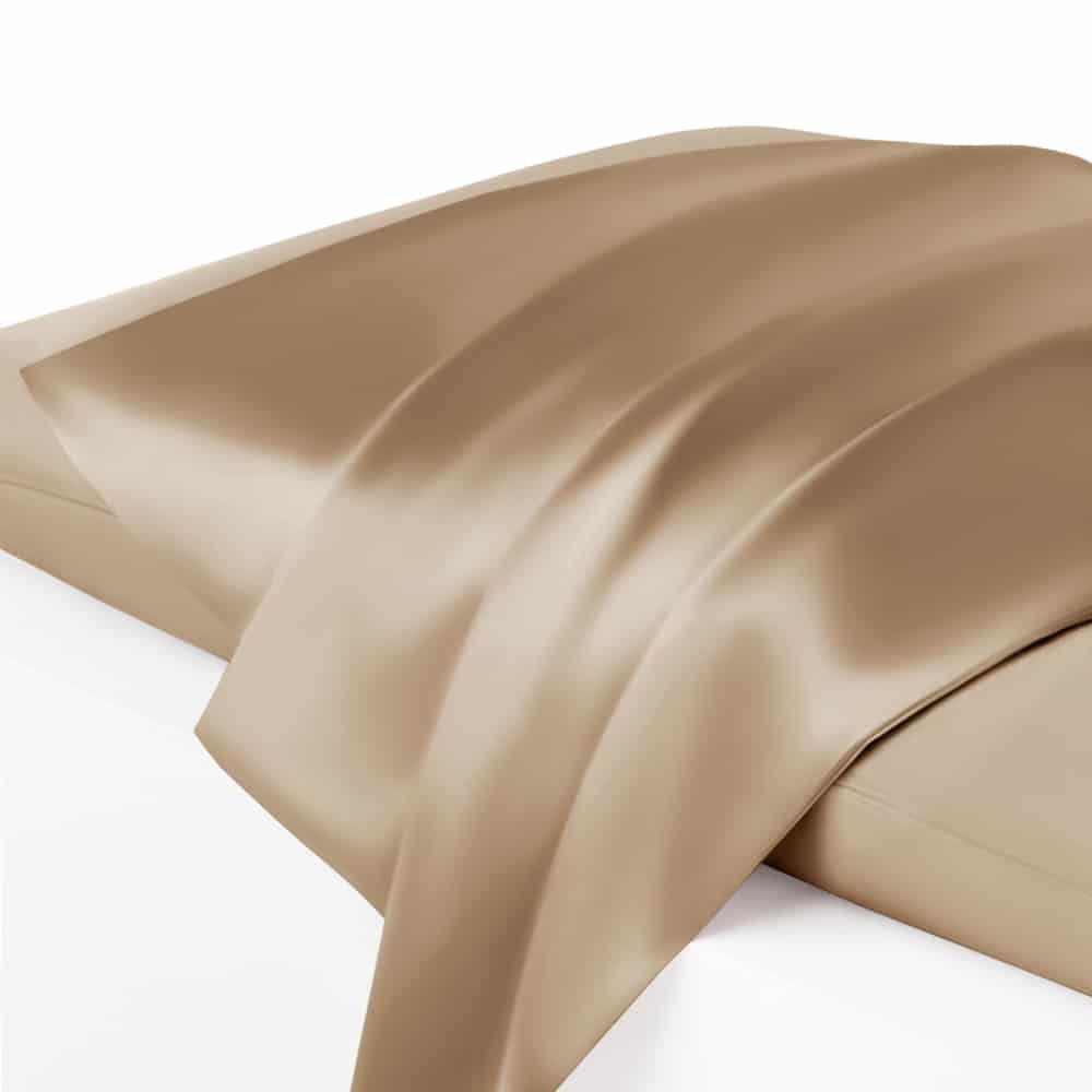 13. Close-up of cappuccino Mulberry silk pillowcase with draped fabric, showcasing sheen