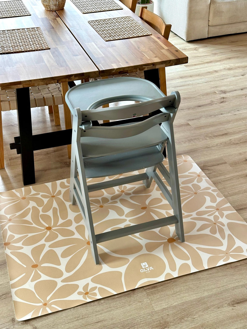 1. Dining room with wooden table and chair on beige daisy-patterned OLYA KIDS floor mat
