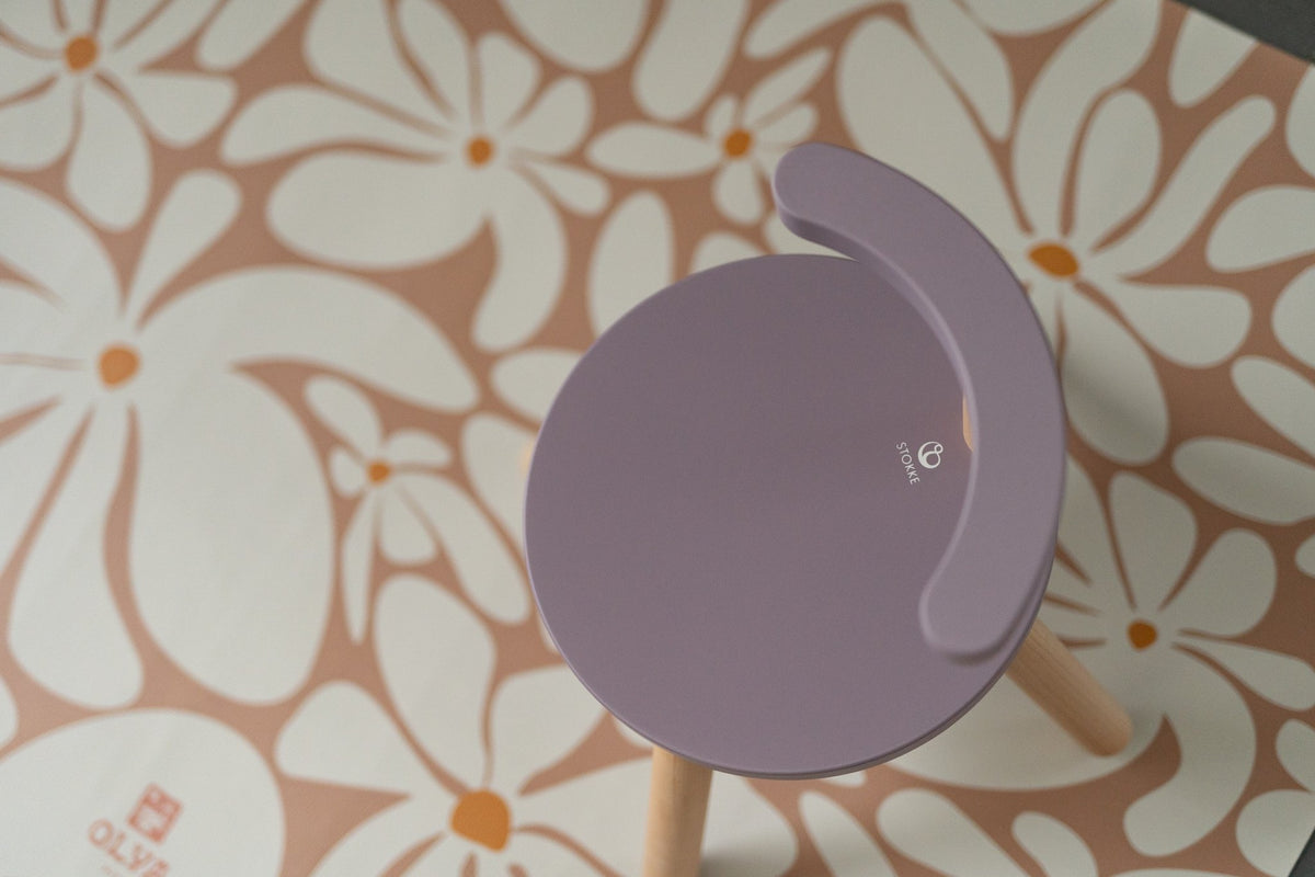 3. Top view of purple chair on daisy-patterned kids' floor mat