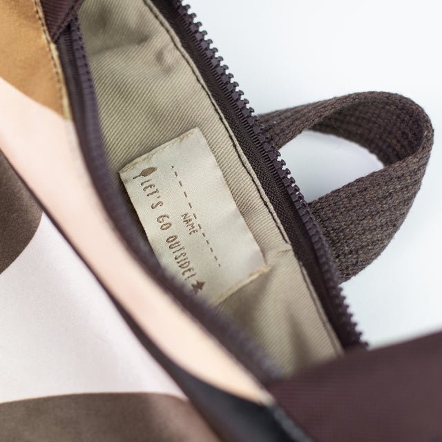 10. Close-up of Muni backpack interior, showing label and zipper detail