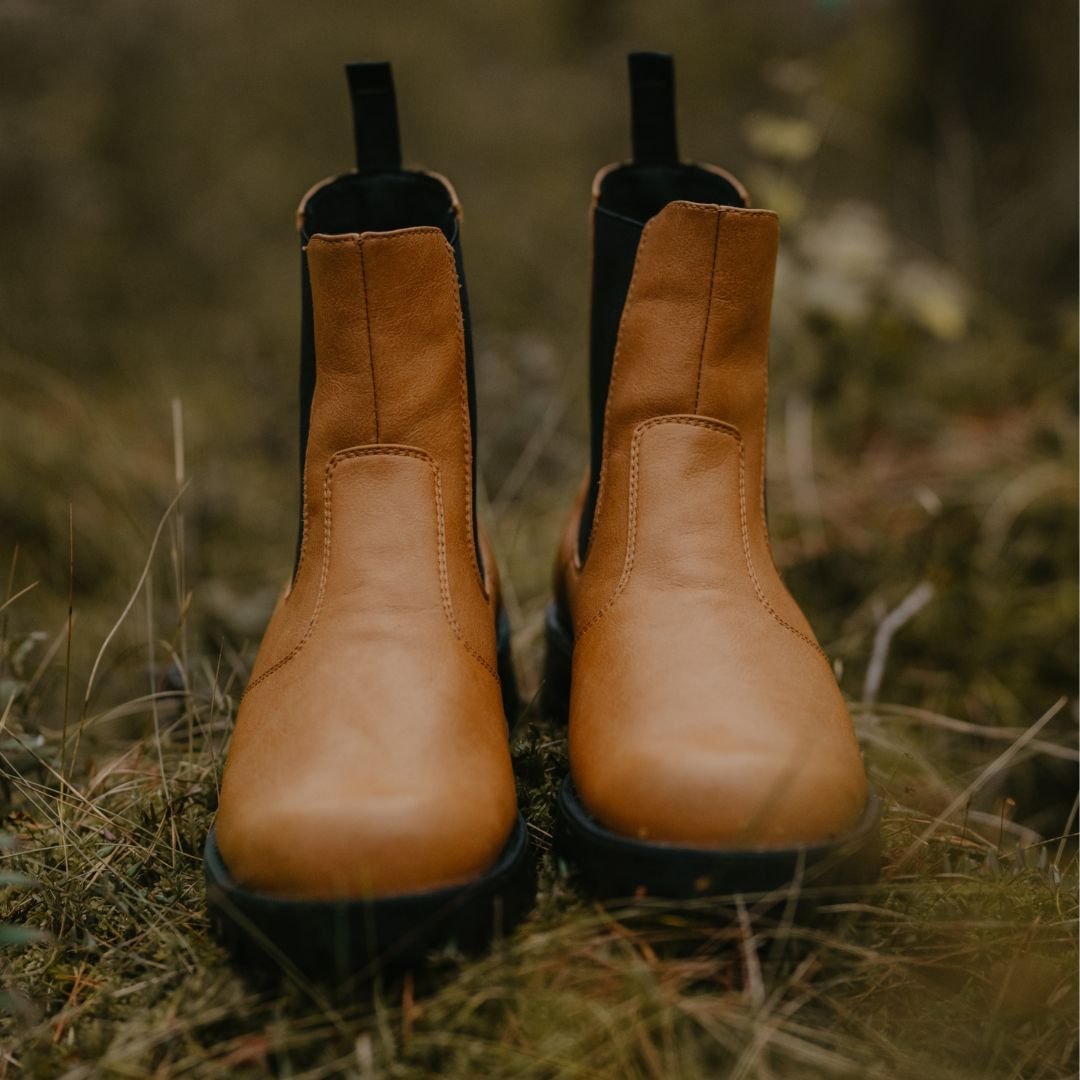 3. Front view of KIRA 3.0 Chelsea Boots in brown, displayed on natural ground