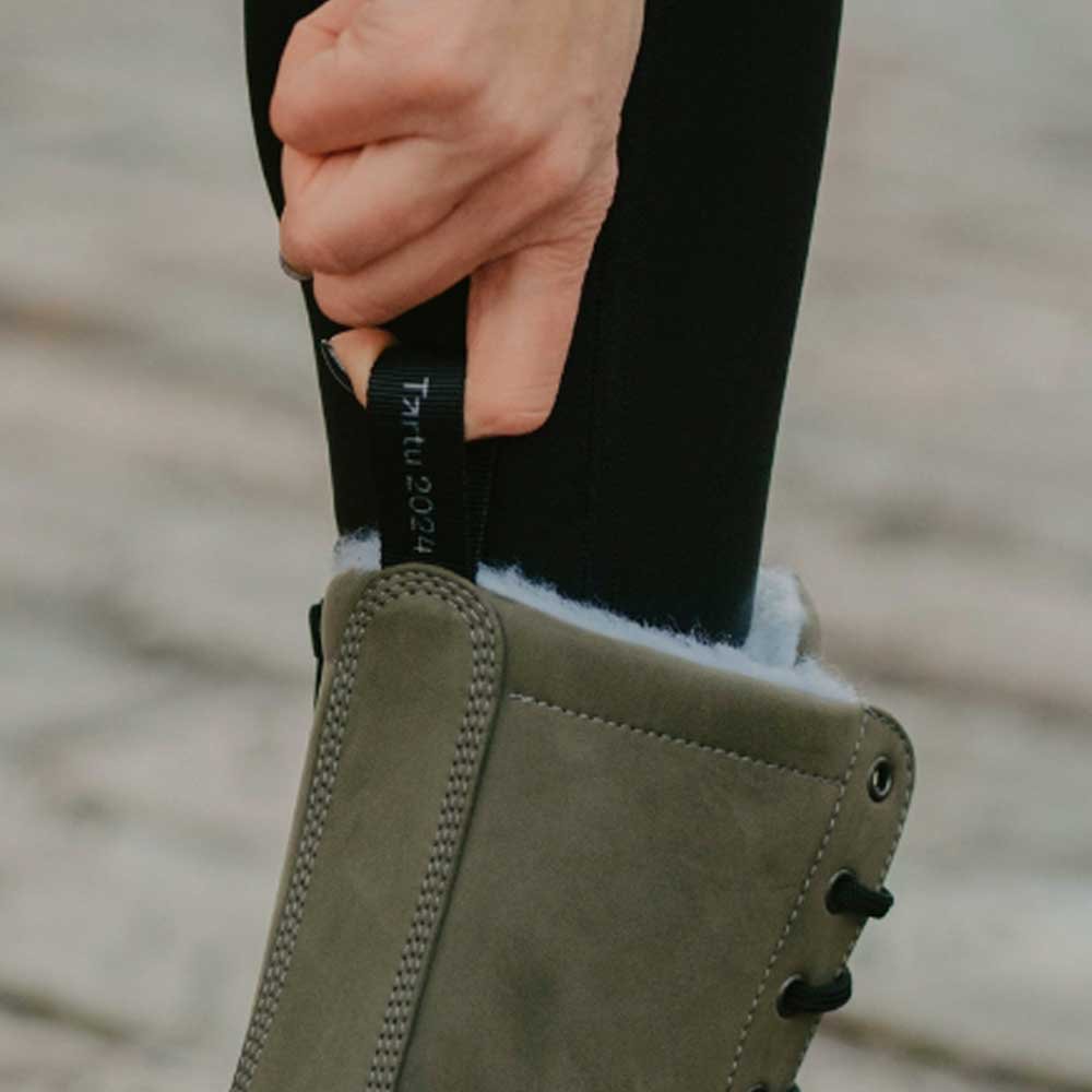 7. Close-up of KIRA 4.0 olive boot pull tab with branding detail