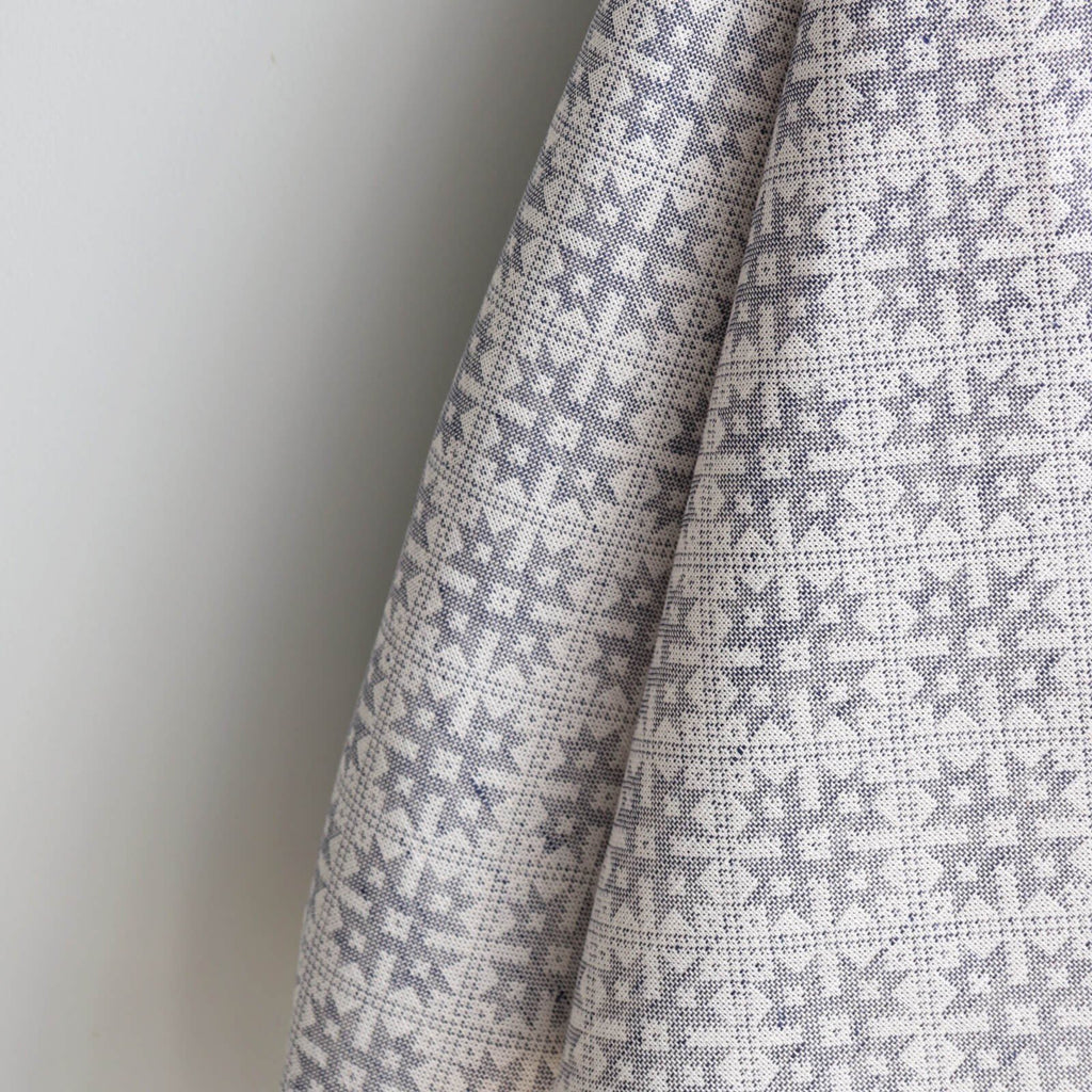 3. Close-up of Pärnumaa folk art pattern on kitchen towel, highlighting intricate grey and white design