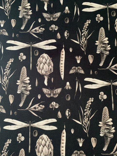 3. Close-up of Seeds Carbon print on Hortensias Home apron featuring botanical and insect motifs