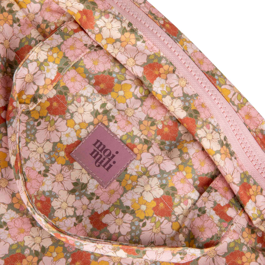 3. Close-up of Moi Mili logo on floral print makeup bag