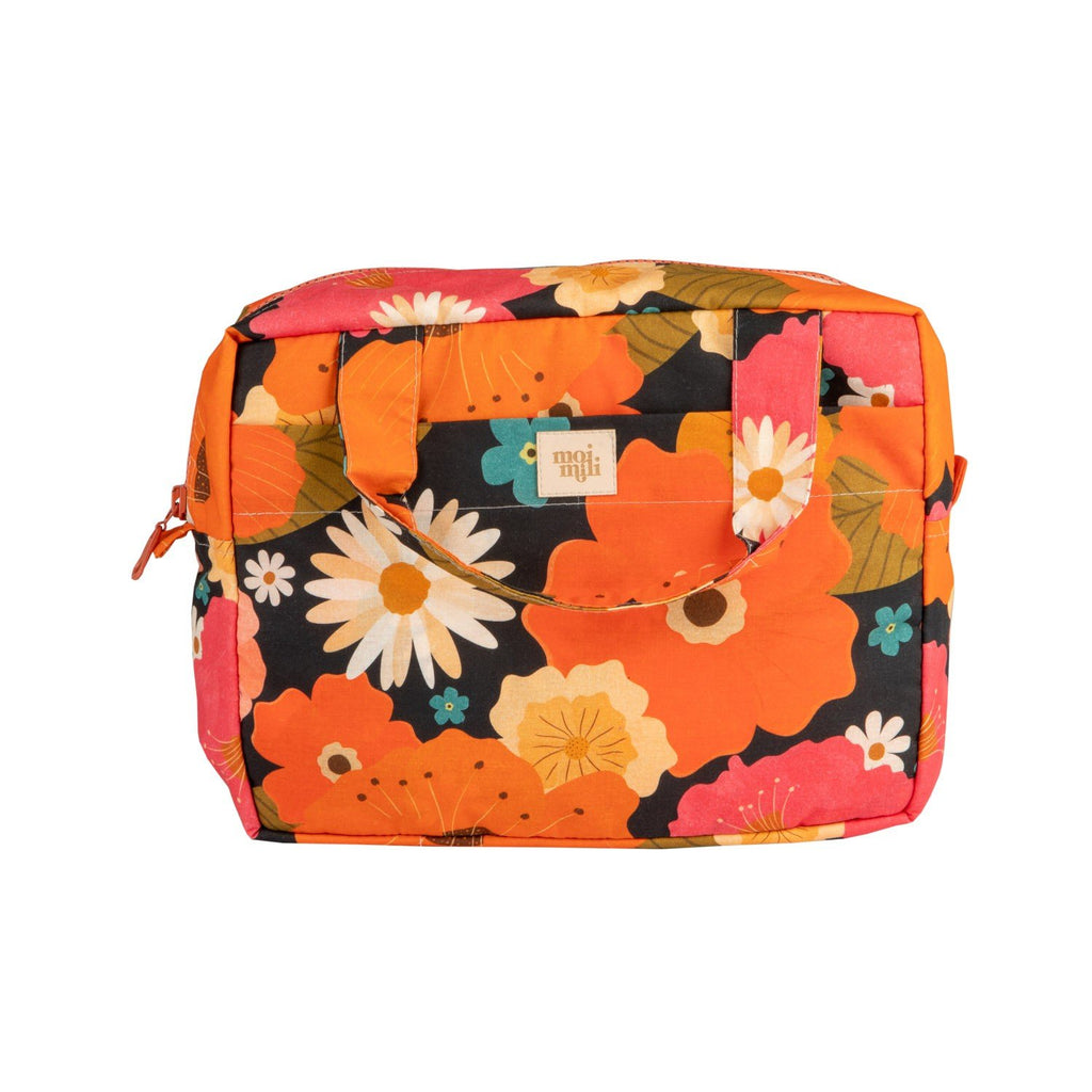 6. Studio shot of large floral print makeup bag with visible brand logo