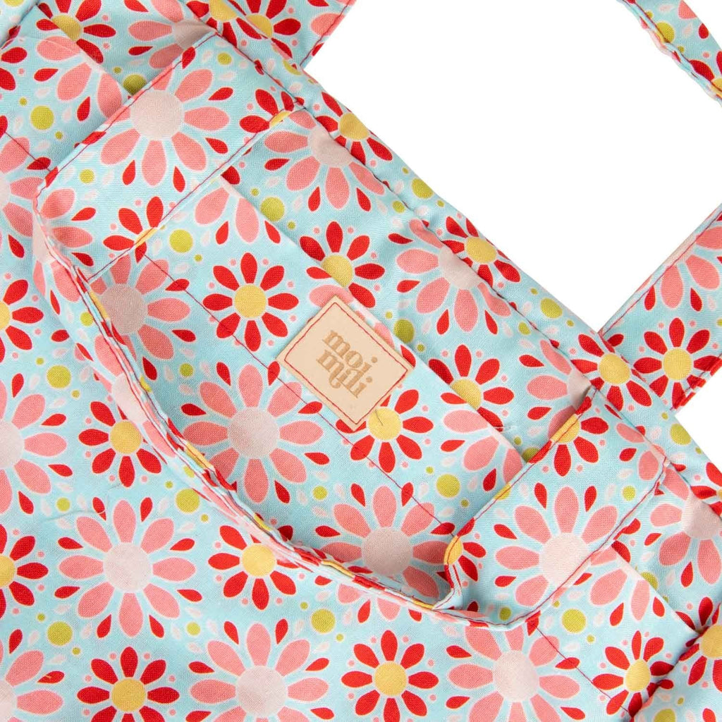 3. Close-up of Moi Mili logo on large makeup bag with red flower print