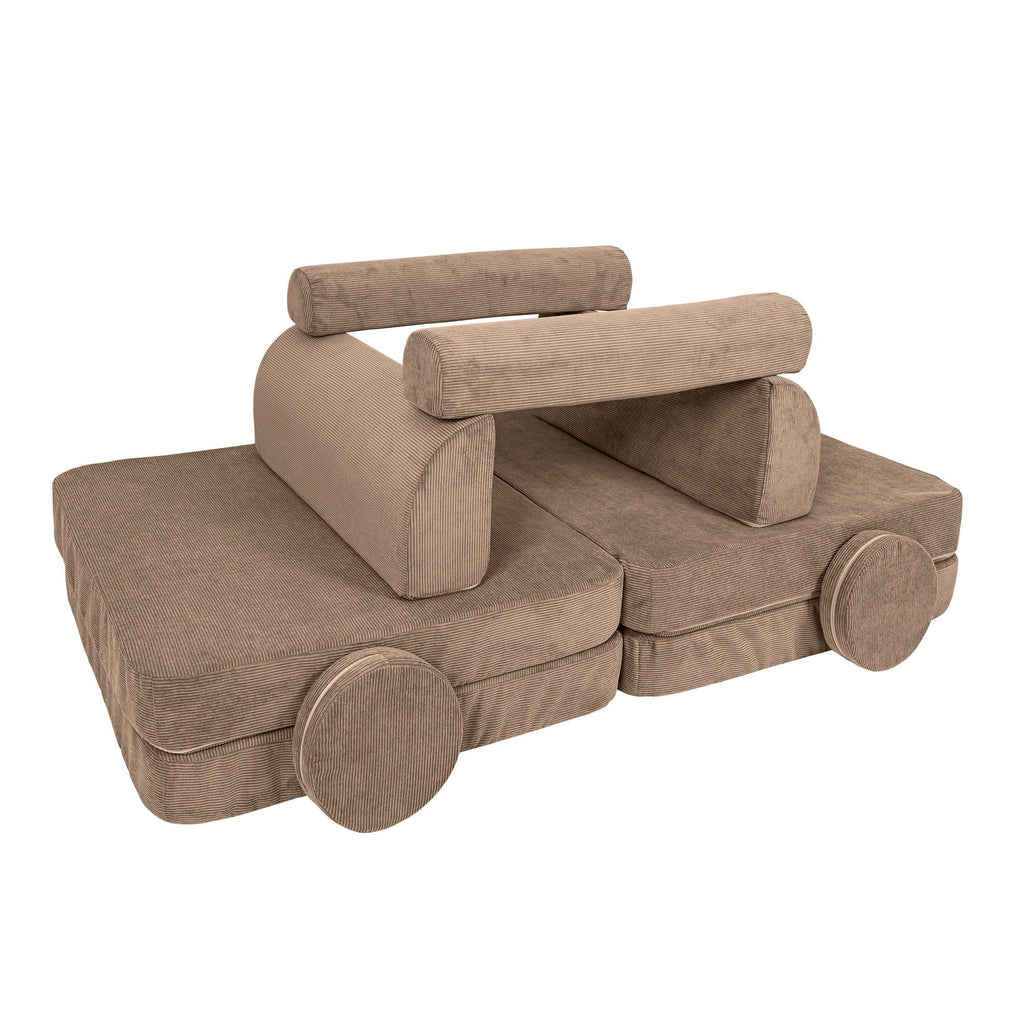 3. Brown modular sofa for kids arranged as a vehicle with round cushions, showcasing creativity