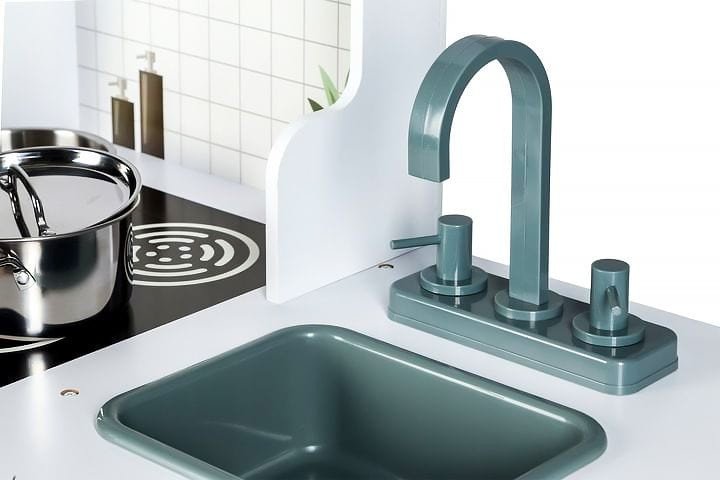 3. Close-up of Angelove play kitchen faucet and sink with pot on stove, highlighting detail and design