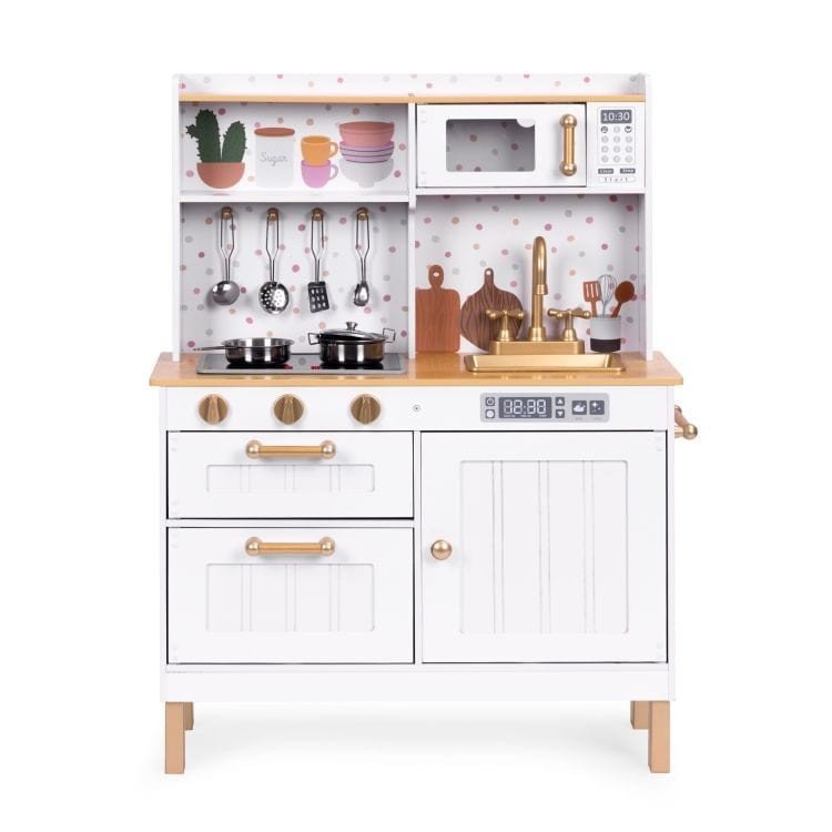 4. Front view of white play kitchen with gold accents, featuring a sink, stove, and hanging utensils, set against a white background.