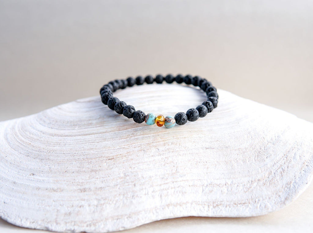 4. Canary Lava stone bracelet with amber and turquoise, showcased on a shell