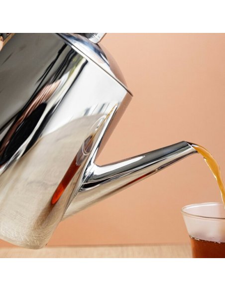 3. Close-up of La Cafetière jug pouring tea into a glass, highlighting polished stainless steel spout