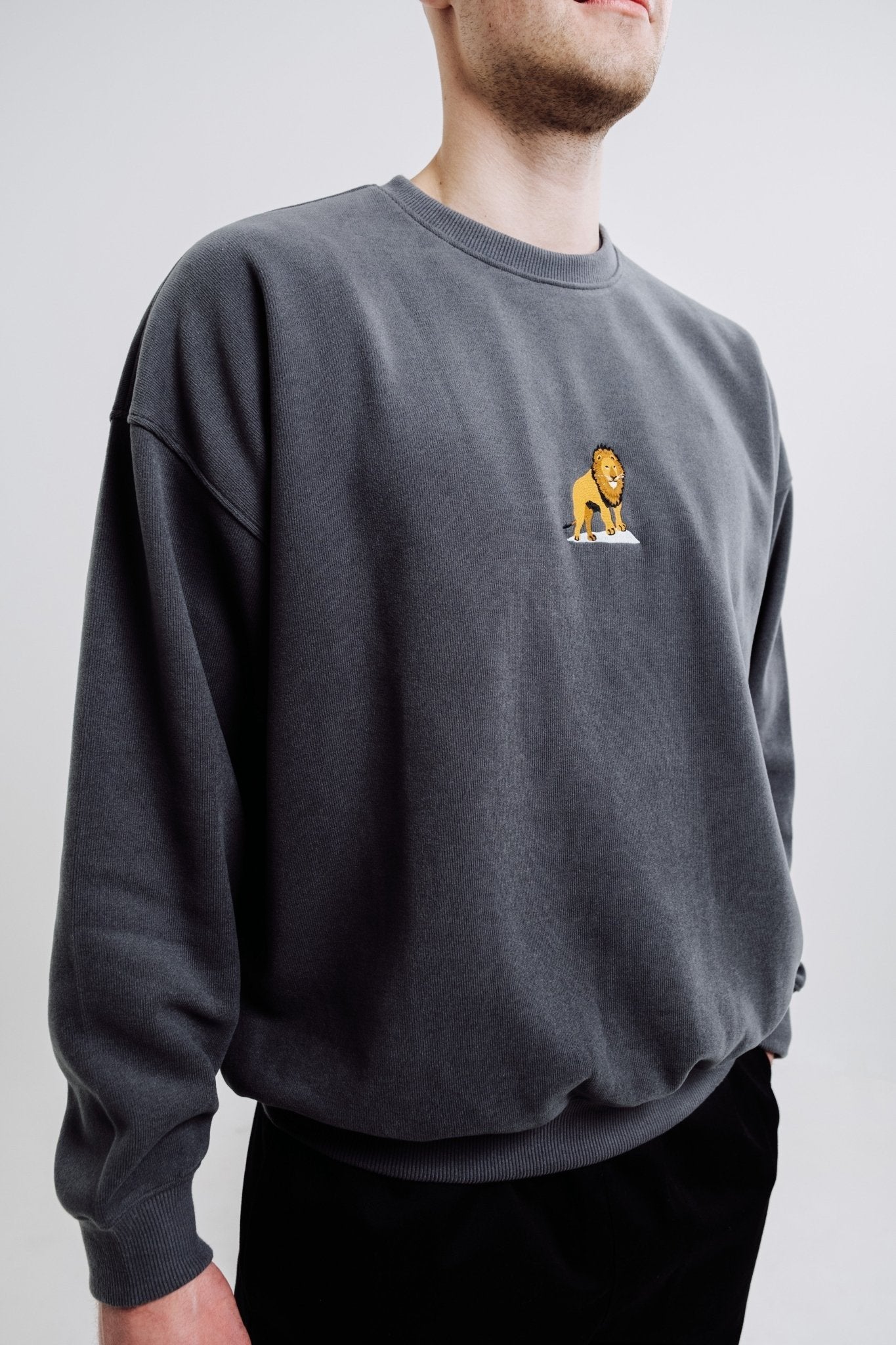 3. Close-up of unisex anthracite Lion Sweatshirt by Sossu showing embroidered lion design