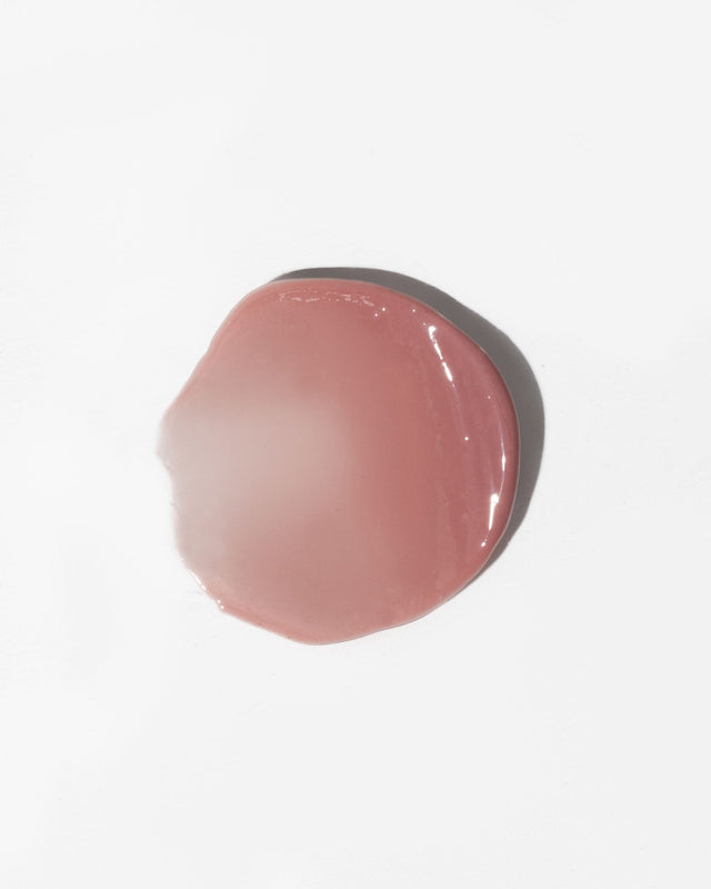 3. Close-up of LUUV Lip Gloss Balm in Dusty Plum showing glossy texture on white background