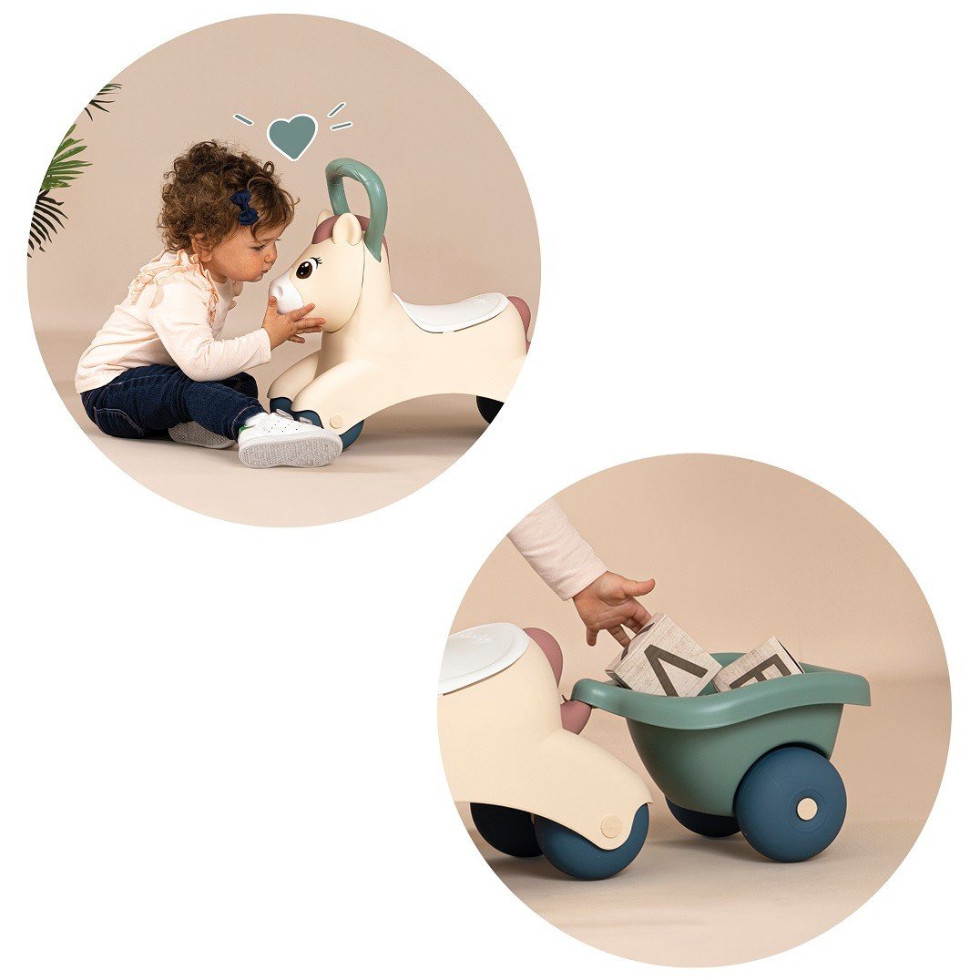 9. Child interacting with beige pony ride-on and green trailer, showing play features