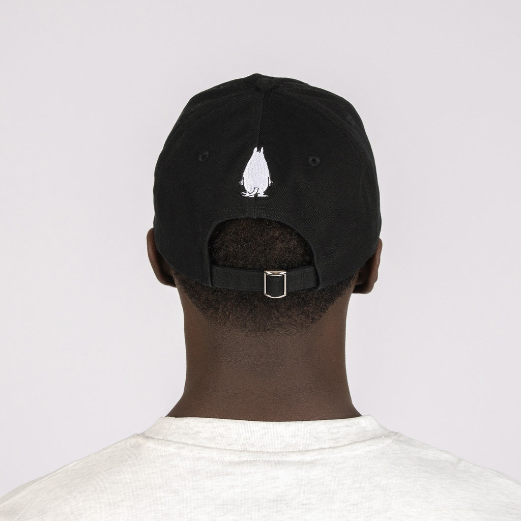 2. Black Grumpy Moomintroll Dad Cap worn by male model, back view highlighting adjustable strap
