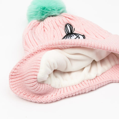 4. Inside view of pink Moomin beanie showing soft white fleece lining and green pom-pom