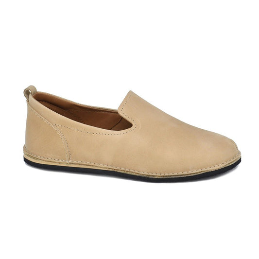 1. Studio shot of Omaking TOKU London Classic Shoes in beige leather, side view showing slip-on design and flexible outsole