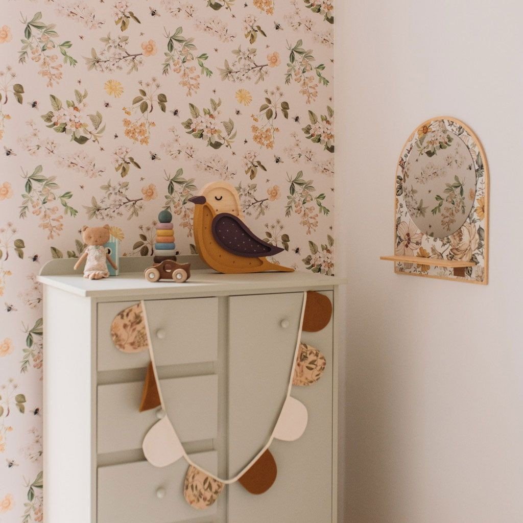 1. Children's room with Dekornik Lovely Bee Orchard wallpaper, featuring floral and bee pattern, a white dresser, and decorative toys