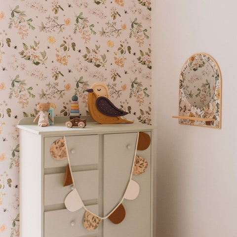 1. Children's room with Dekornik Lovely Bee Orchard wallpaper, featuring floral and bee pattern, a white dresser, and decorative toys