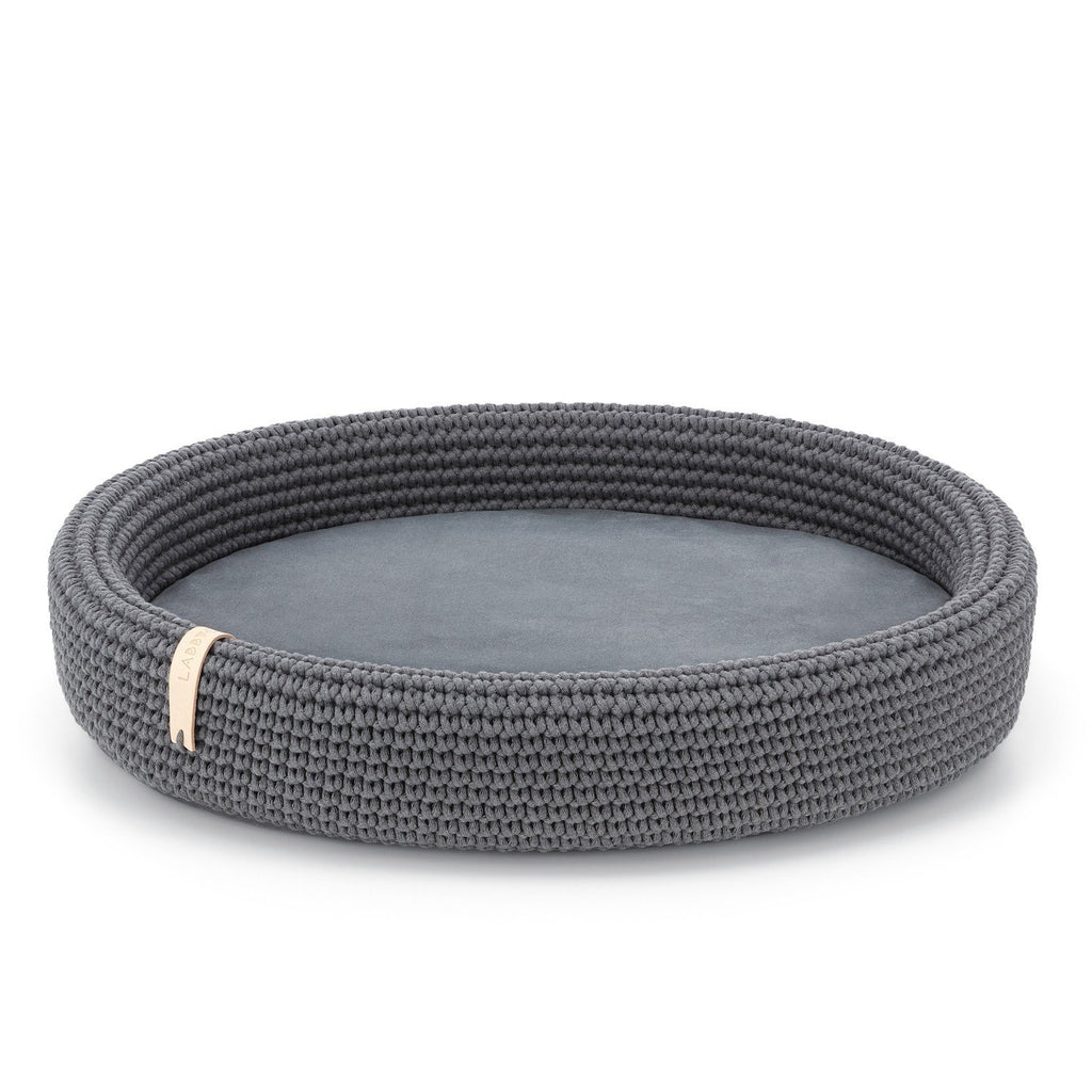 2. Studio shot of Labbvenn Lukko dog bed in anthracite, featuring oval shape and braided cotton rope design with removable cushion