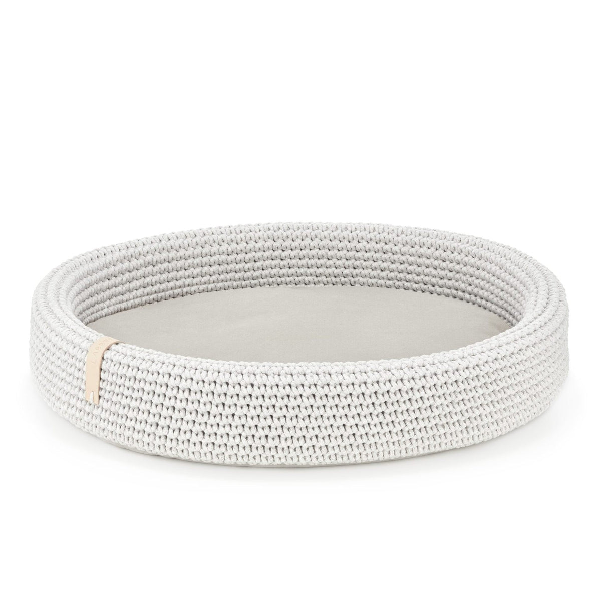 3. Studio shot of light grey oval braided cotton dog bed with removable cushion