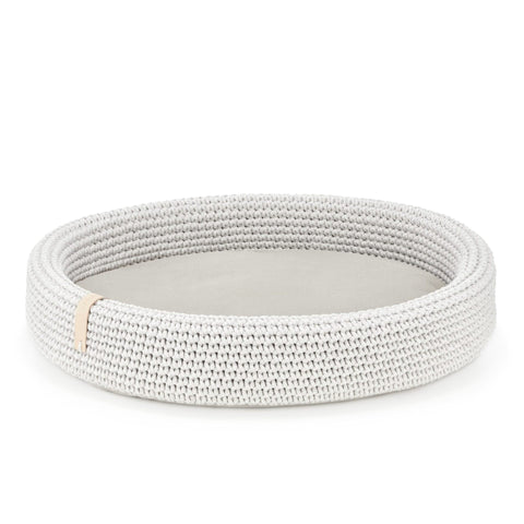 3. Studio shot of light grey oval braided cotton dog bed with removable cushion