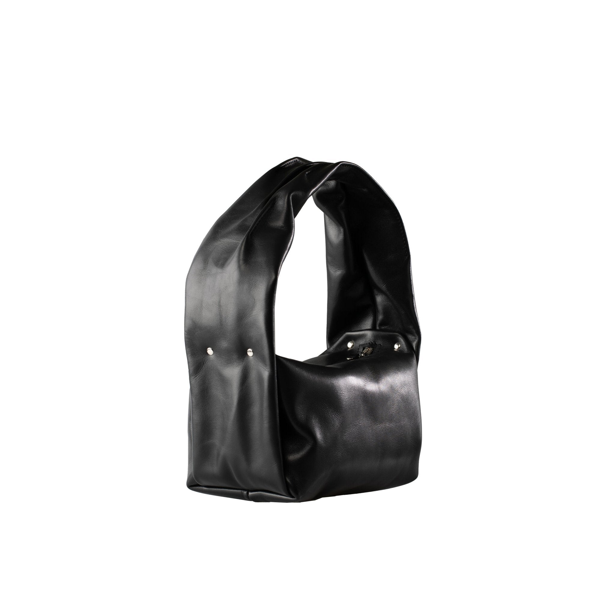 7. Studio image of PYKOK Soft Leather Baguette Handbag Luna in black, showcasing spacious design