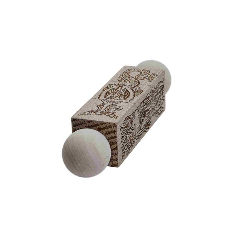 3. Close-up of natural wooden spinning puzzle showing engraved mythical creature and spherical ends