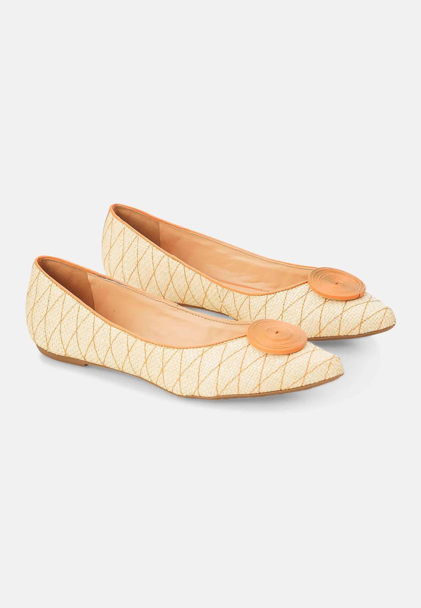 11. Pair of Mangará Coroba Ballerinas in studio, showcasing raffia fabric and pointed-toe design