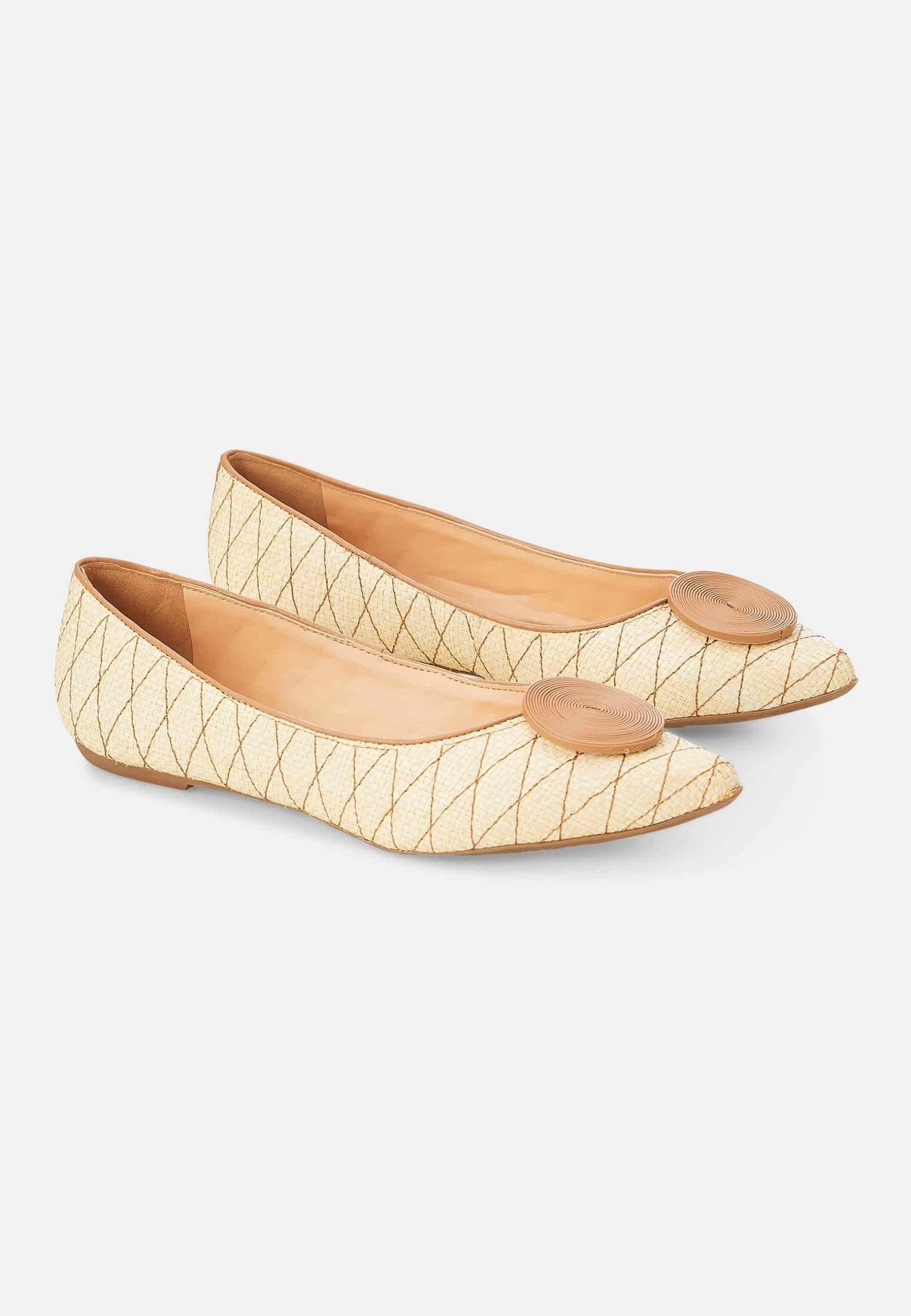 12. Pair of Mangará Coroba Ballerinas in studio, showcasing raffia fabric and pointed-toe design