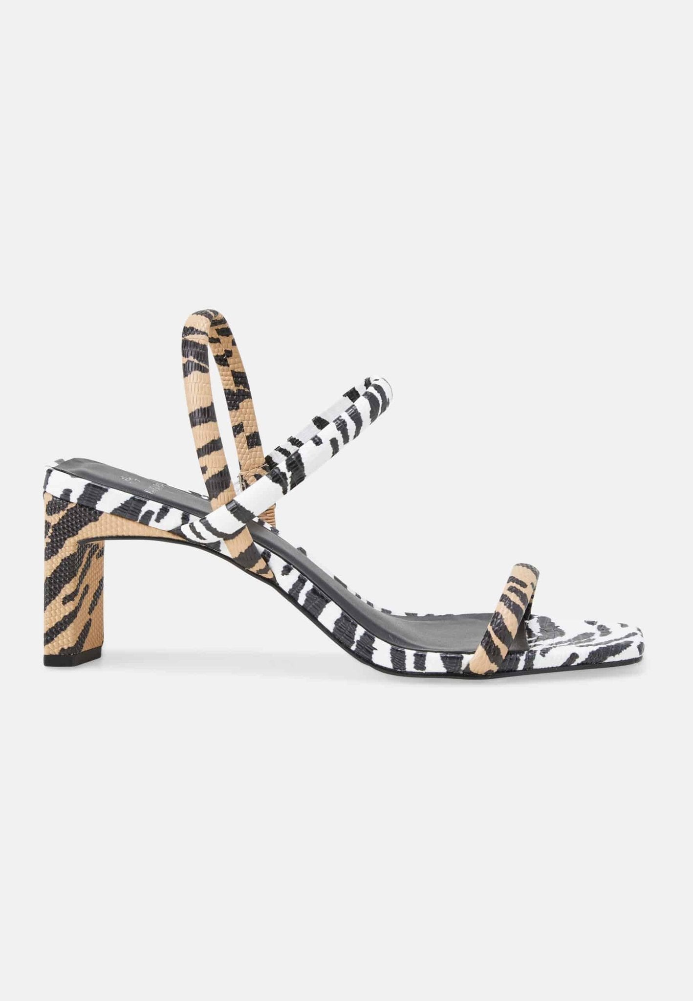 4. Studio side profile of Mangará women's sandals in animal print with block heel