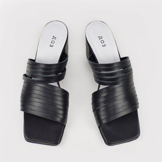 2. Women's black leather sandals by Daz Studio, top view highlighting strappy design and squared toe