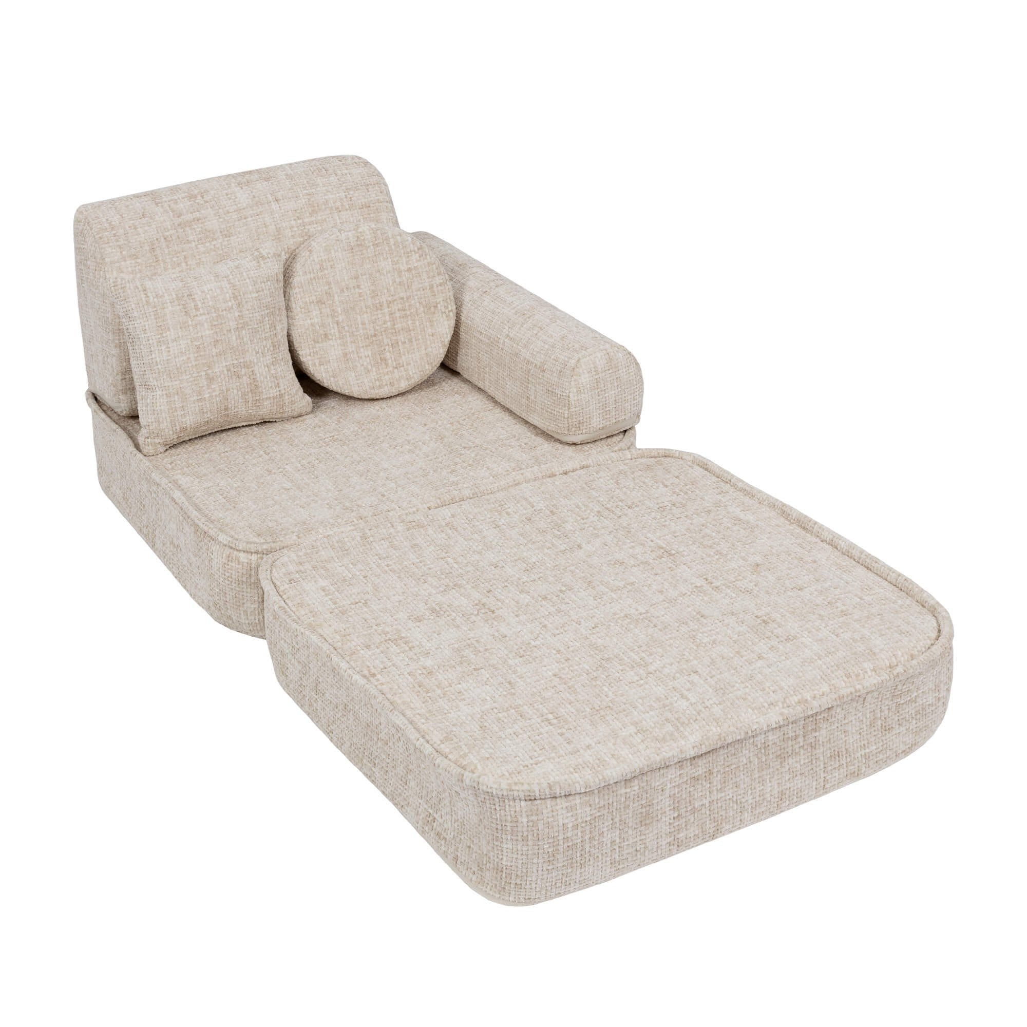 3. Beige modular children's sofa with extended seat, shown in a studio setting