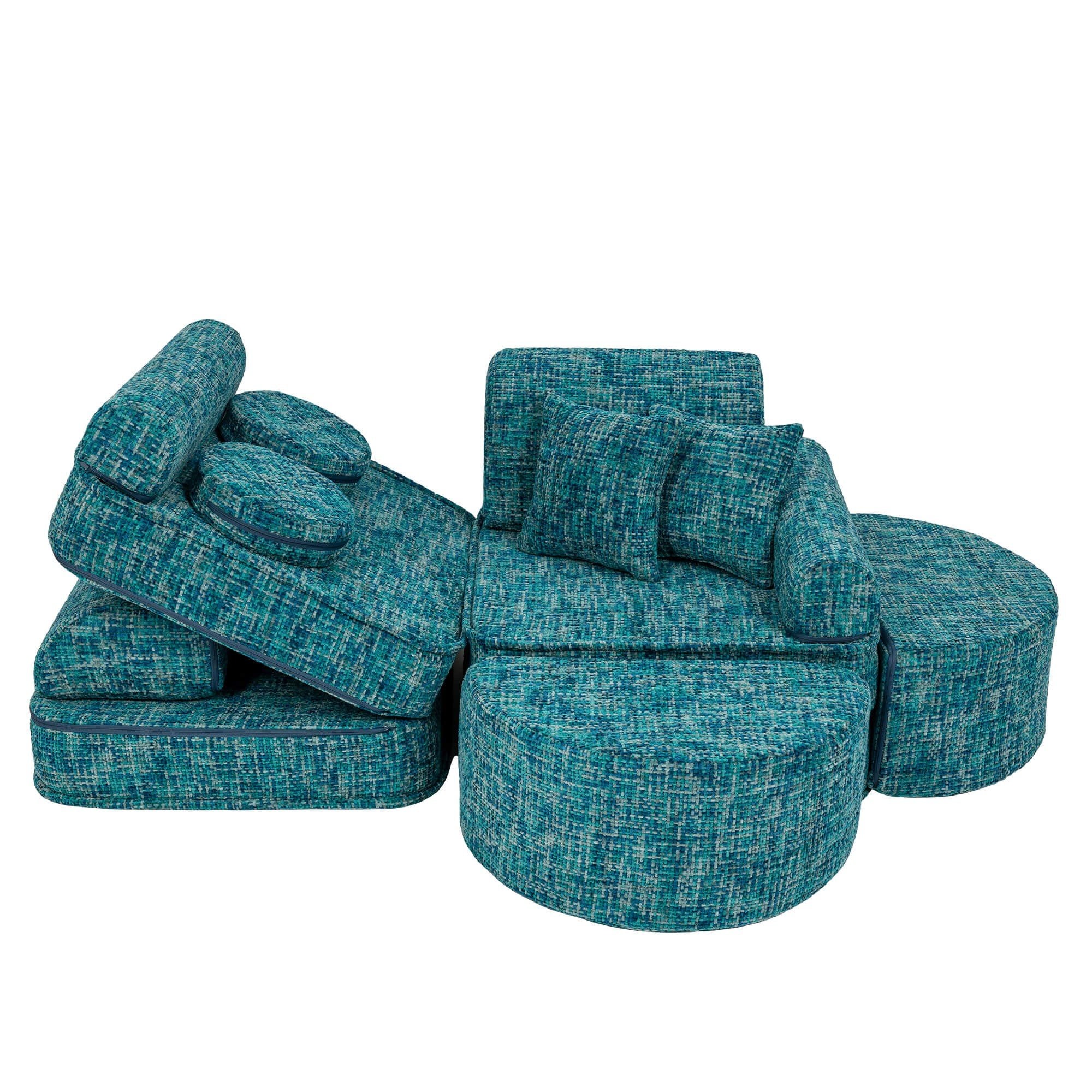 3. Side view of lagoon blue modular sofa with cushions and ottomans in a staggered arrangement