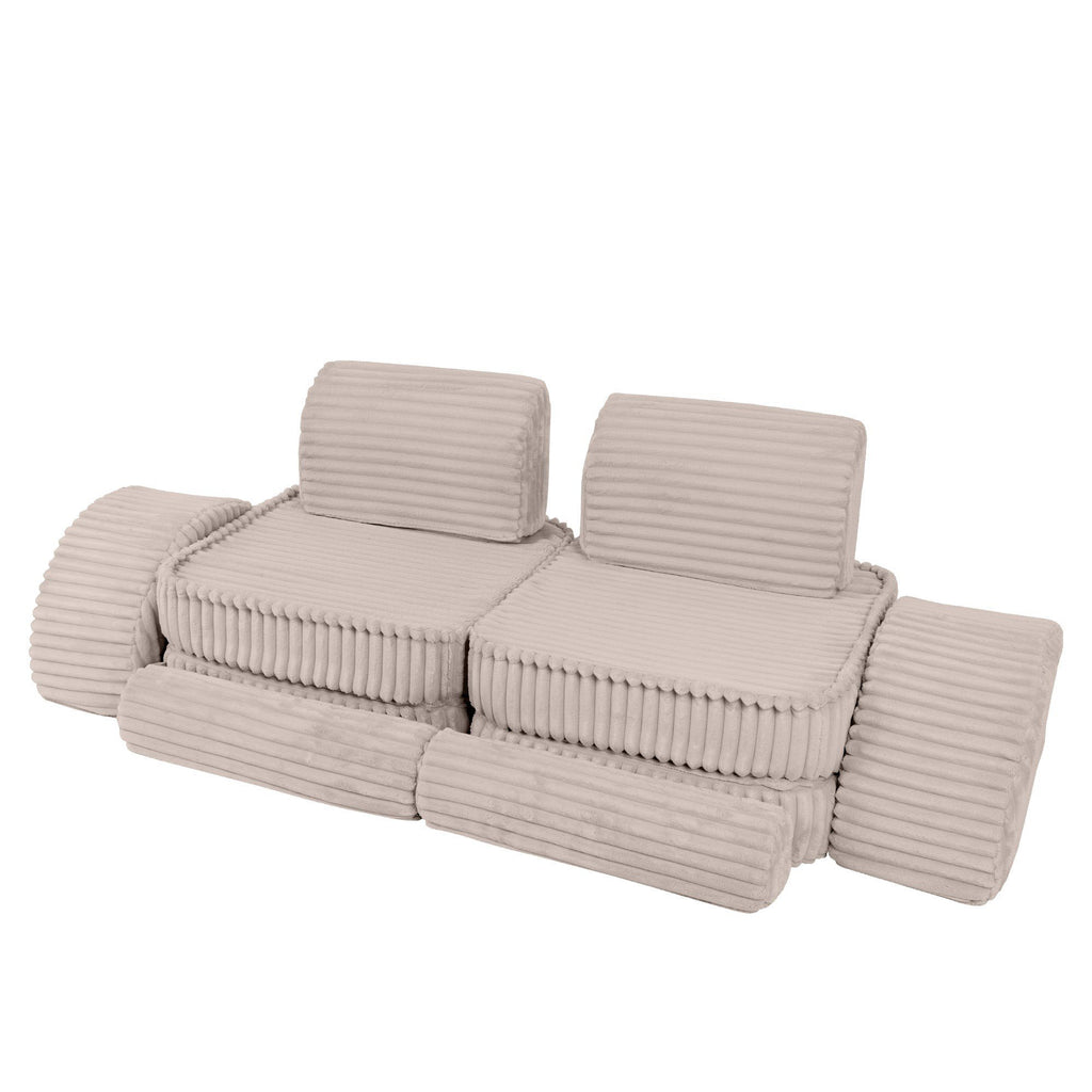 9. Beige modular kids sofa with ribbed corduroy texture, arranged in a linear layout with cushions