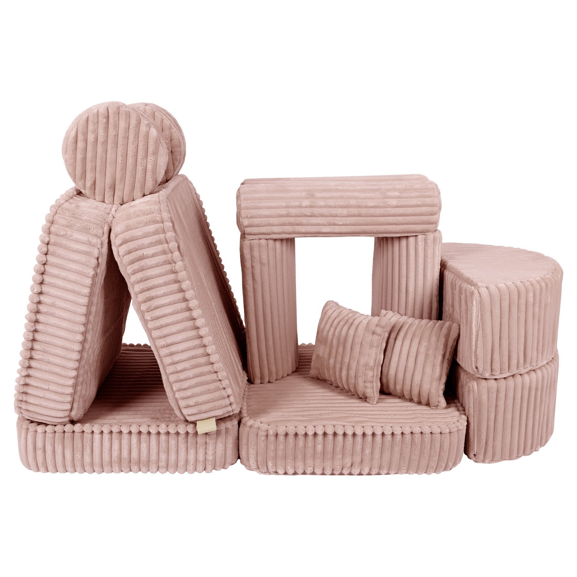 5. Medium modular kids sofa in churros pink with ribbed corduroy fabric, creatively arranged in a tent-like structure with cushions.