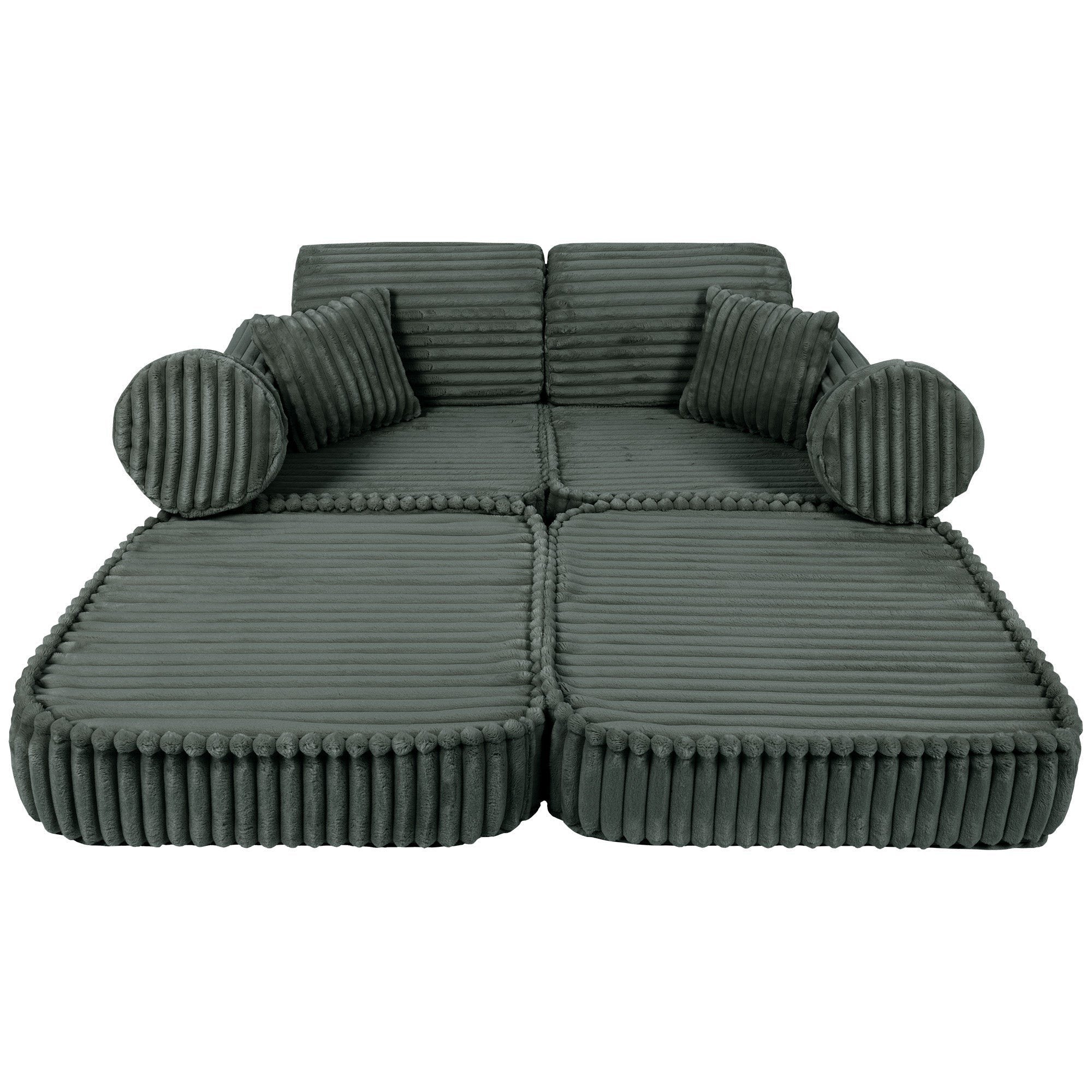 3. Medium modular kids sofa in forest green, fully extended to form a flat lounging area, highlighting its adaptability.
