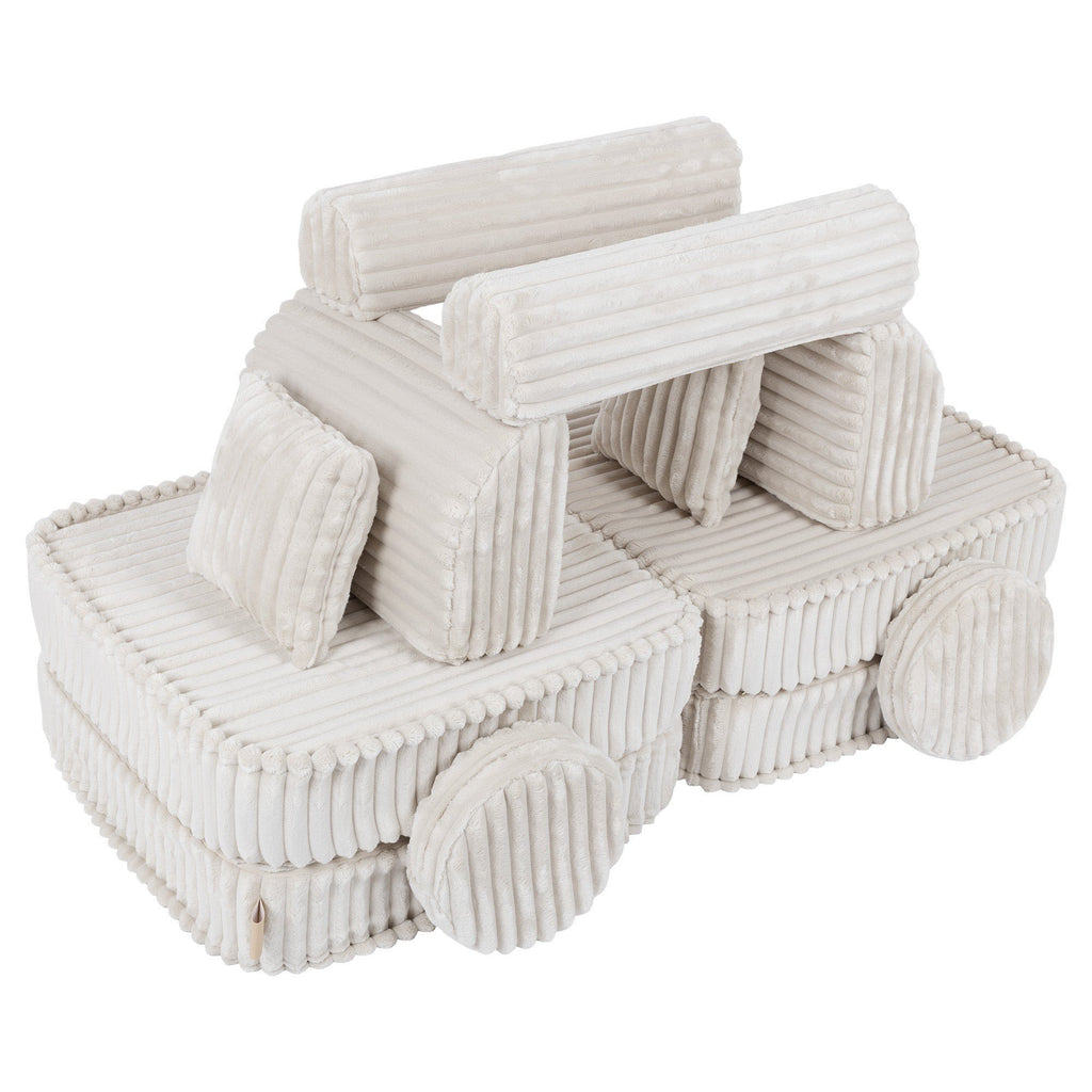 3. Medium kids sofa in churros white with ribbed corduroy fabric, configured as a playful vehicle shape with round cushions as wheels.
